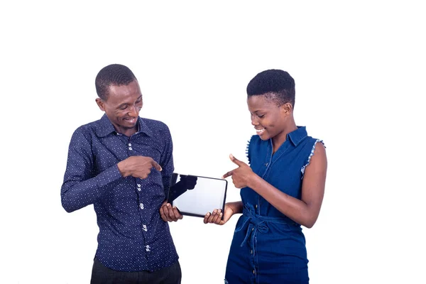 Young Couple Standing White Background Showing Tablet While Smiling — Stock Photo, Image