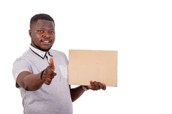 Portrait Handsome Young Man Holding Piece Blank Cardboard Showing His — Fotografia de Stock