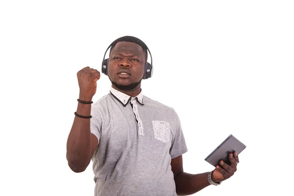 Portrait Handsome Displeased Young Man Listening Music Headphones Digital Tablet — Fotografia de Stock