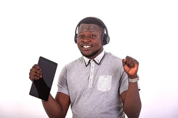 Handsome Happy Young Man Listening Music Headphones Digital Tablet While — Φωτογραφία Αρχείου