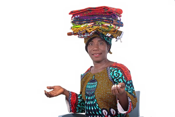 Portrait Beautiful Woman Sitting Chair Holding Several Traditional Loincloths Her — Fotografia de Stock