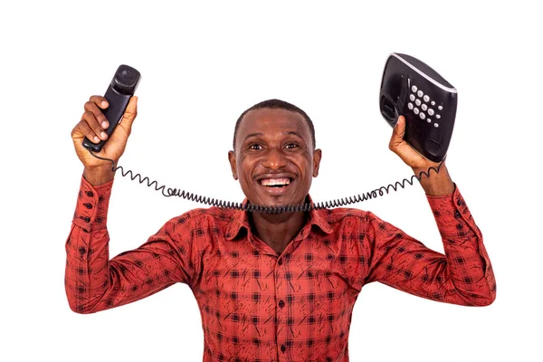 Pohledný Obchodník Kostkované Košili Stojící Bílém Pozadí Smějící Prezentující Telefon — Stock fotografie