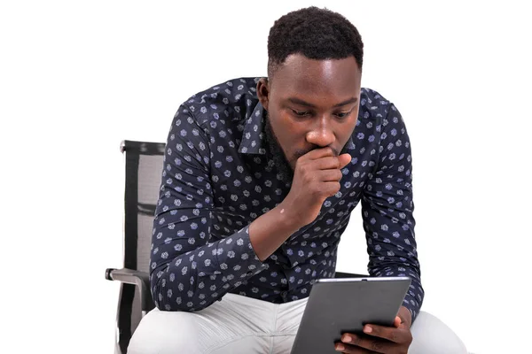 Young Bearded Man Sitting White Background Looking Tablet Amazement —  Fotos de Stock