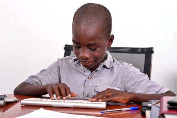 Young Boy Sitting Office Touching Keyboard Smiling — Stock Photo, Image