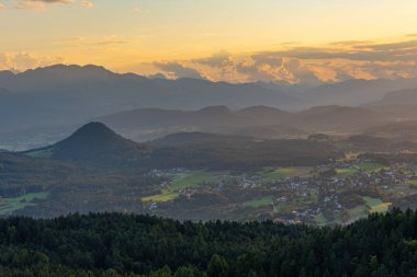 Sunset panorama view of Alps from Pyramidenkogel viewpoint in Austria.IMAGE
