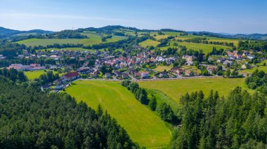 Church and Velhartice village in Czech republic.IMAGE