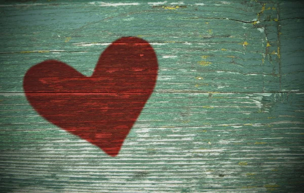 Red heart on the old board — Stock Photo, Image