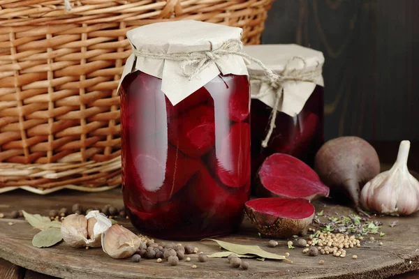 Canned beetroot in glass jars on rustic wooden background, closeup, food storage solution, canned produce, batch cooking, saving leftovers, plastic free eco friendly concept