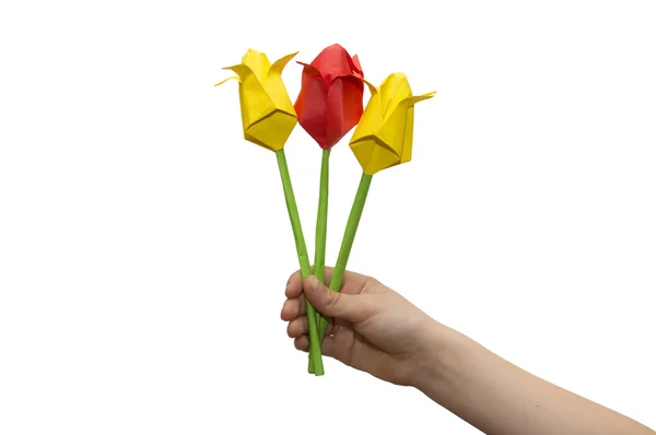 Child hands cutting colored red paper with scissors isolated Stock Image