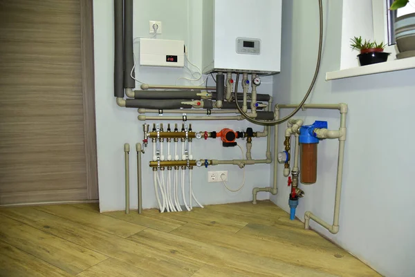 Independent heating system in boiler room at home. Domestic water supply system. Water supply for underfloor heating. Rainwater filter system. Servo, sensors and temperature control. Soft focus