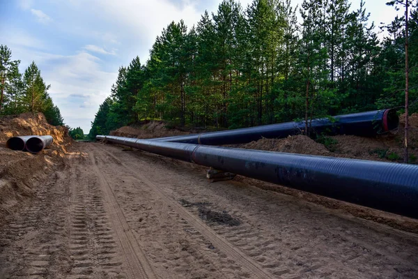 Construction Gas Pipeline Project. Natural Gas and Crude oil  Transmission in pipe to LNG plant (shipped by LPG tanker). Building of transit petrochemical pipe in forest area. Pipes Welding