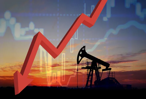 Crude mining concept and graph of falling oil prices on the trading exchange. Crude oil pump jack at oilfield on sunset backround. Fossil crude output and fuels oil production. Oil drill rig