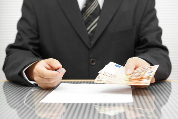 Banker offering money if you sign contract — Stock Photo, Image