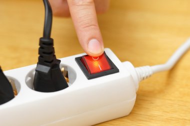 turn off the button on power connector to save on electricity bi clipart