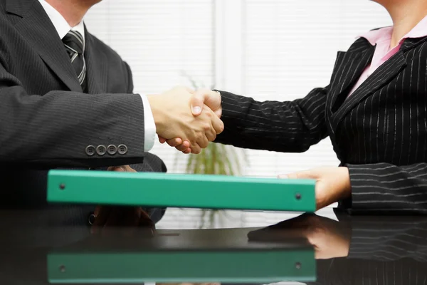 Businessman is passing binder with documentation  to his client — Stock Photo, Image