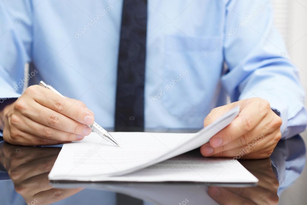 Businessman is checking final price in contract