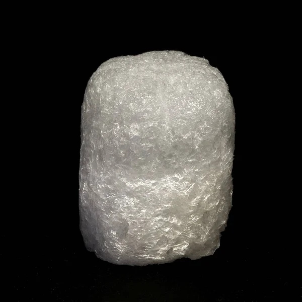 Foam peanut on black background. Isolated object