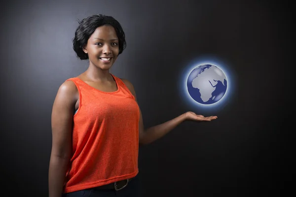 South African or African American woman teacher or student holding world earth globe — Stock Photo, Image