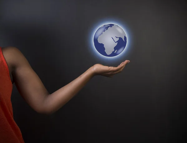 South African or African American woman teacher or student holding world earth globe Stock Picture