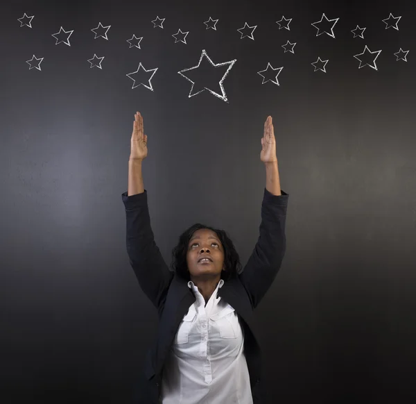 South African or African American woman teacher or student reaching for the stars success — Stock Photo, Image