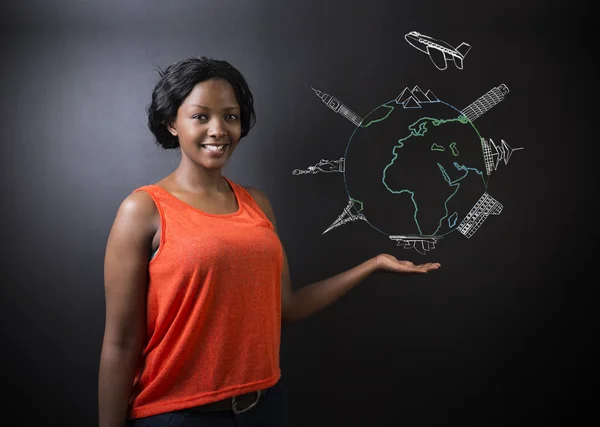 South African or African American woman teacher or student with chalk globe and jet world travel — Stock Photo, Image