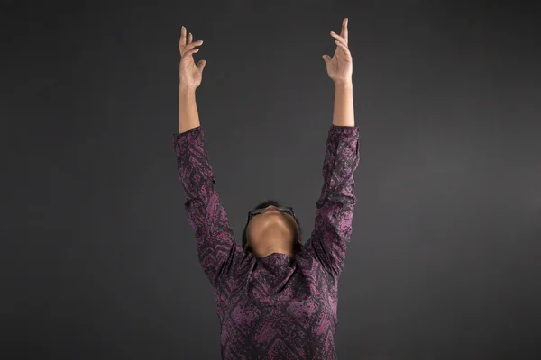 South African or African American woman teacher or student reaching for the sky on blackboard background — Stock Photo, Image