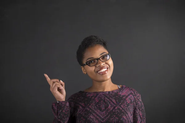 African woman good idea on blackboard background Stock Fotó