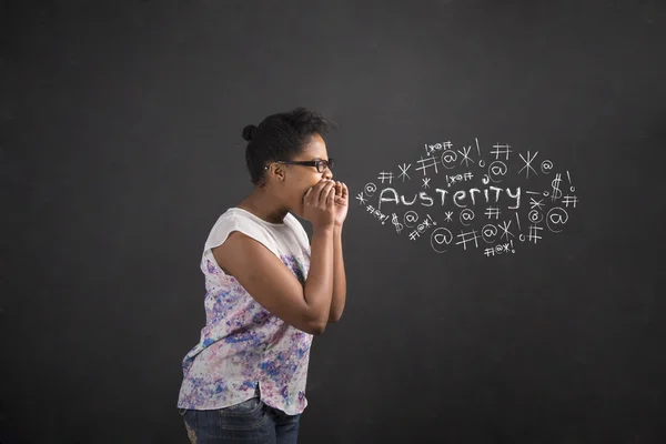 African American woman shouting, screaming or swearing austerity on blackboard background — Stock Photo, Image