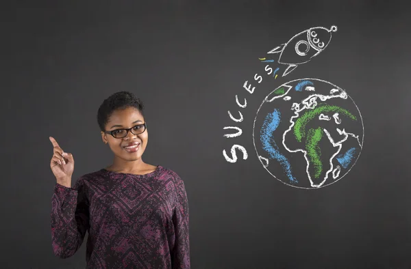 African woman good idea about world success on blackboard background — Stock fotografie