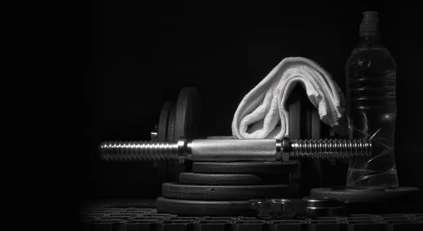 Equipment for strength training on a dark background. — Stock Photo, Image