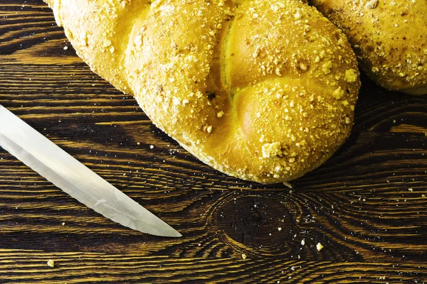 Knife and rich bread — Stock Photo, Image