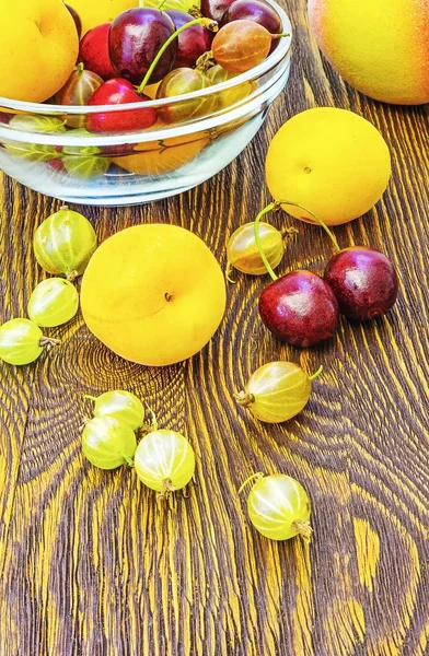 Apricot gooseberries and cherries — Stock Photo, Image