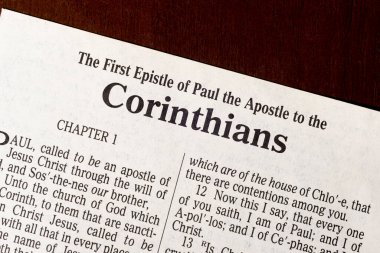 This is the King James Bible translated in 1611.  There is no copyright.  First Corinthians Title Page Close-up. clipart