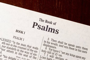 This is the King James Bible translated in 1611.  There is no copyright.  Macro photo of the title page of Psalm clipart