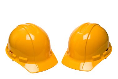 İki sarı zor şapka veya inşaat kask