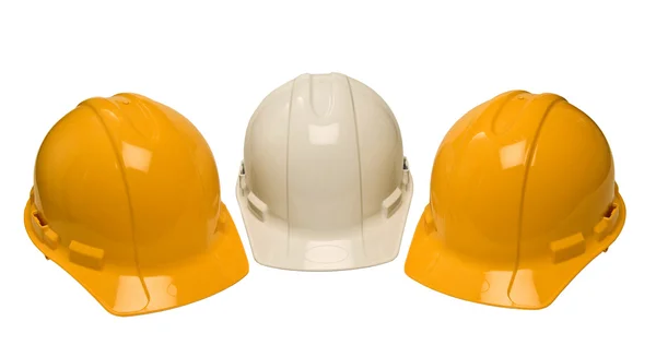 Tres sombreros de construcción aislados — Foto de Stock