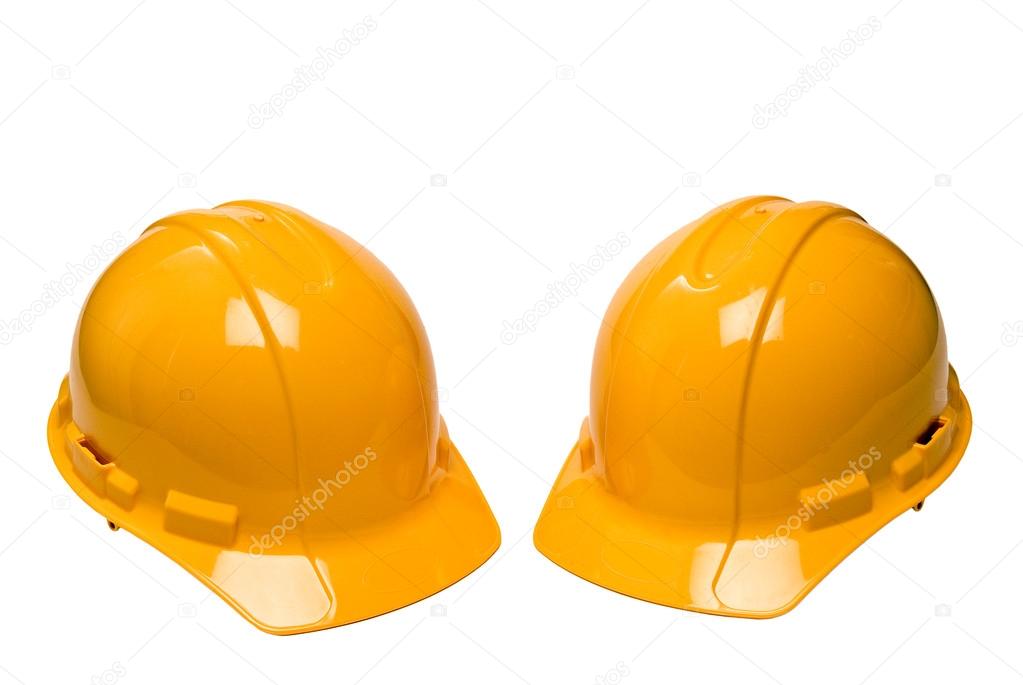 Two Yellow Hard Hats Or Construction Helmets