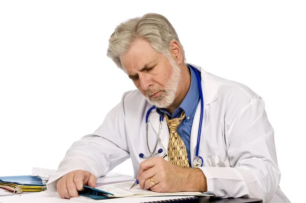 Lekarz praca późno na jego biurko — Zdjęcie stockowe