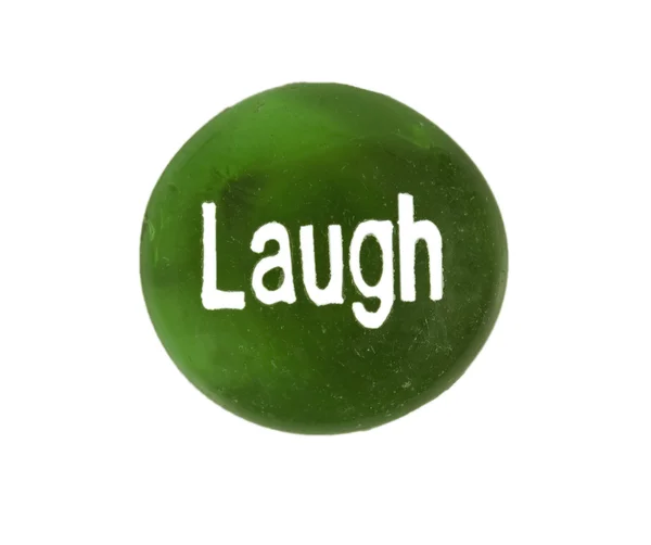 Pedra de encorajamento dizendo 'rir' isolado em branco — Fotografia de Stock
