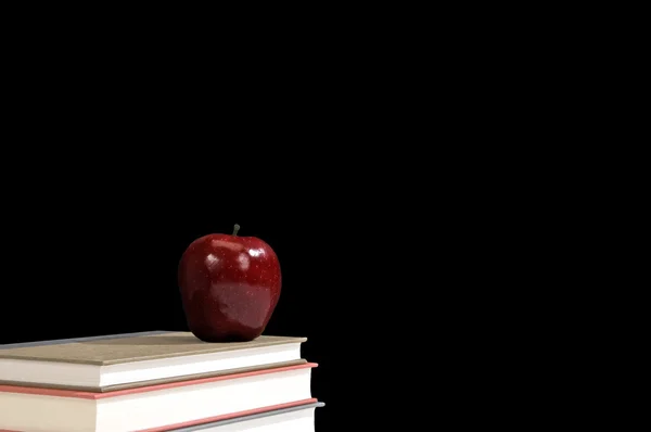 Stack Of Books With Red Apple And Blackboard As Background. — Stock Photo, Image