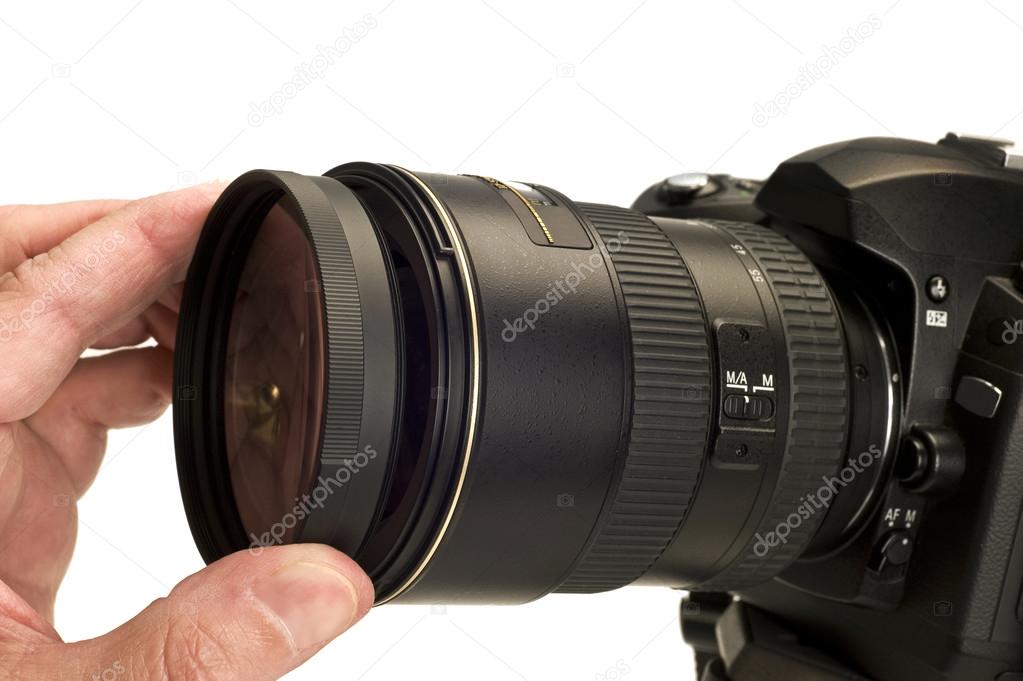 Hand Attaching Filter To Camera Lens