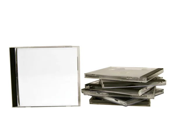 Apiladas cajas de CD en blanco con uno de pie —  Fotos de Stock