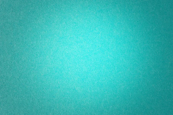 Teal blau strukturiertes Papier Hintergrund leichter in der Mitte lizenzfreie Stockfotos