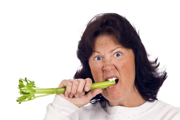 Overweight Woman Unhappy And Trying To Eat Celery — Stock Photo, Image