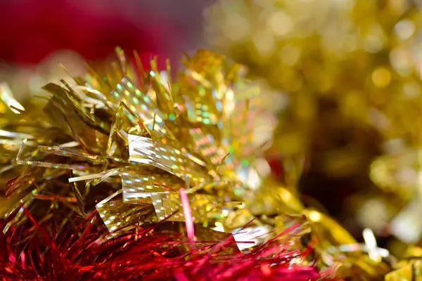 Abstract New Year and Christmas long horizontal background. Red and gold tinsel, the background is blurred. — Stock Photo, Image