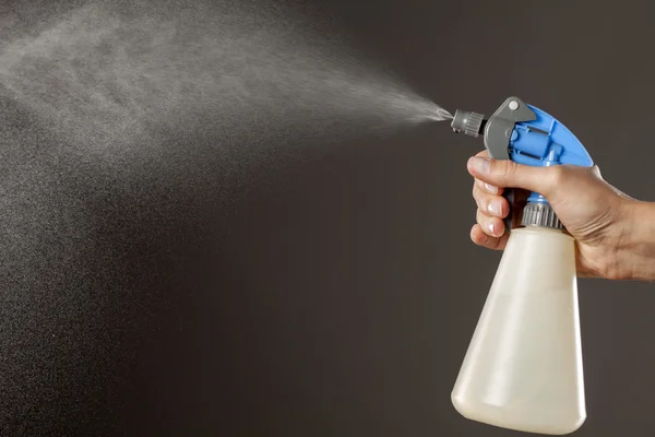 Liquid spraying bottle — Stock Photo, Image