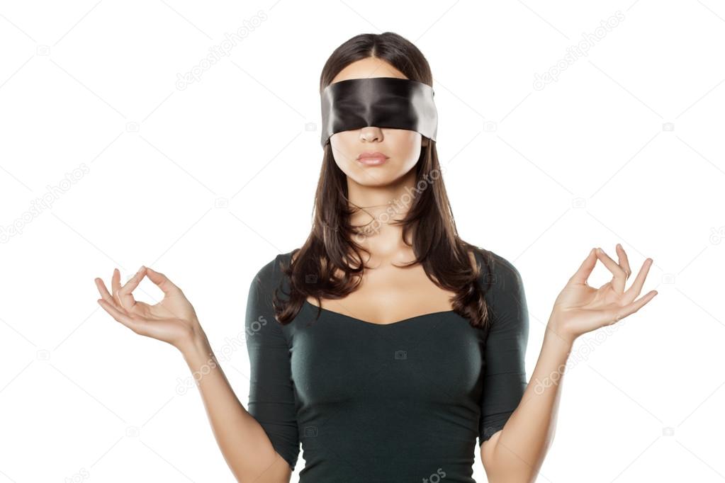 blindfolded and meditatating