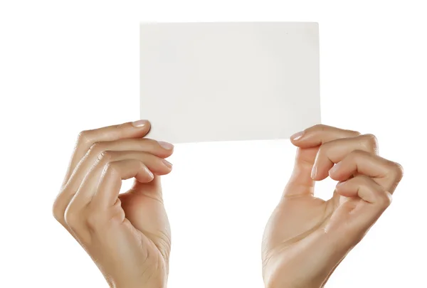 Manos sosteniendo hoja de papel en blanco —  Fotos de Stock