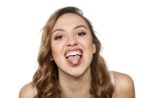 Funny with her tongue out — Stock Photo, Image