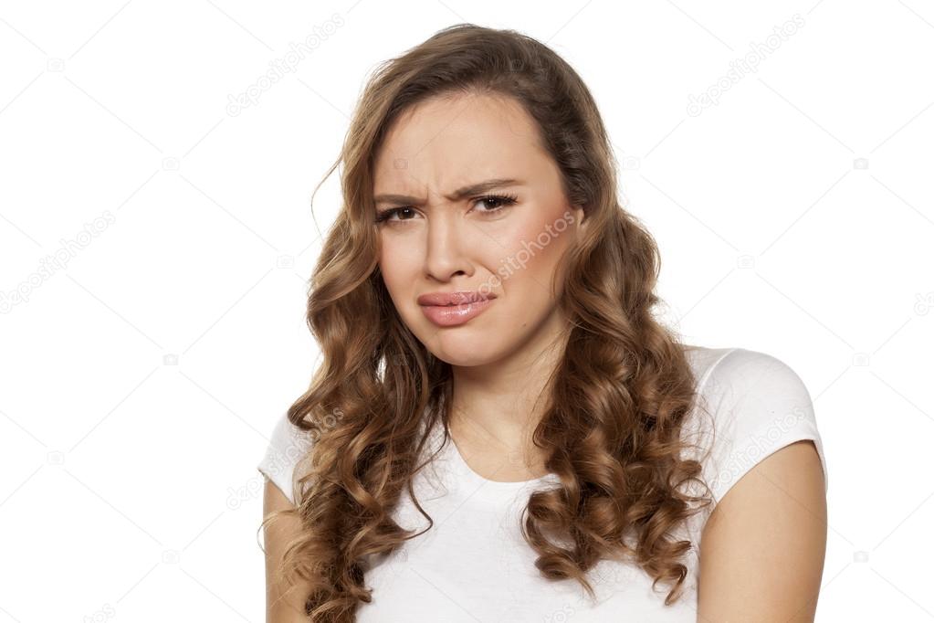 Disgusted beautiful girl Stock Photo by 104395688